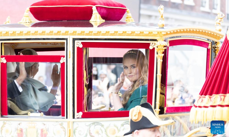 Dutch Princess Amalia waves to people in the Glass Coach on Prinsjesdag, Prince's Day, in The Hague, the Netherlands, on Sept. 17, 2024. The third Tuesday in September is Prince's Day in the Netherlands. It marks the opening of the Dutch parliamentary season, and on this day the reigning monarch outlines the government's plans for the year ahead.  (Photo: Xinhua)