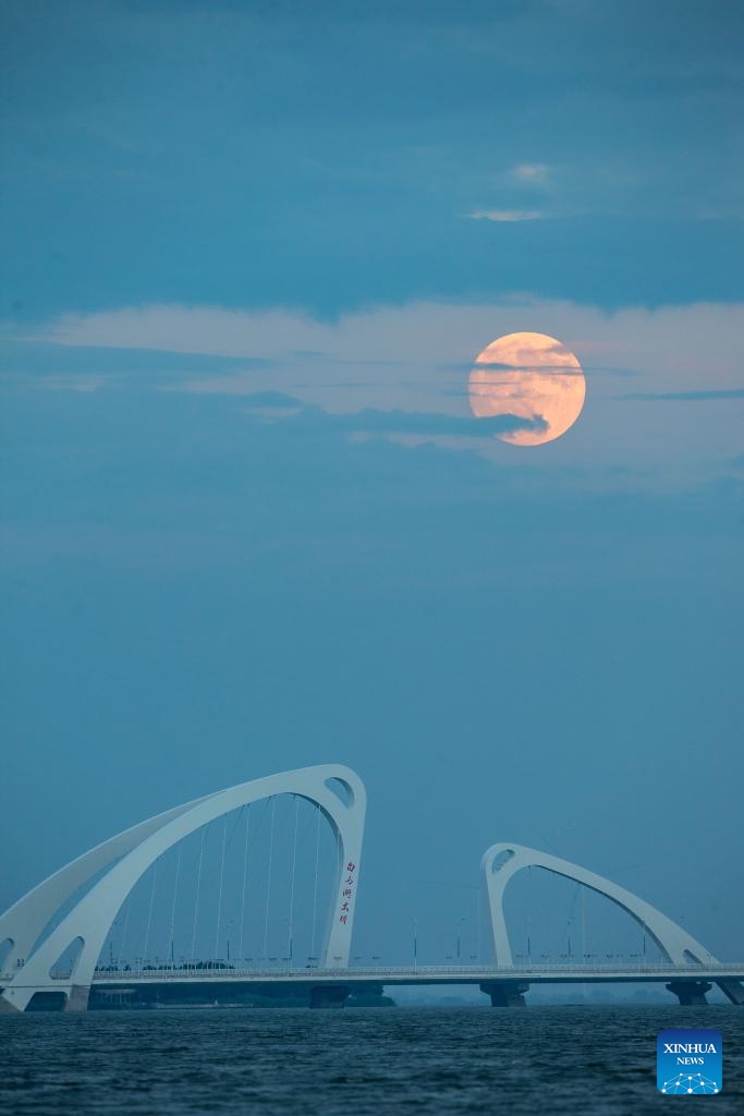 The moon rises above Huai'an City, east China's Jiangsu Province, Sept. 17, 2024. The Mid-Autumn Festival in China, which is celebrated annually on the 15th day of the eighth month in the Chinese lunar calendar, falls on Sept. 17 this year. As one of China's most important traditional holidays, it is a joyous time when families come together, appreciate the full moon and share moon cakes, a traditional pastry, to mark the harvest season.  (Photo: Xinhua)