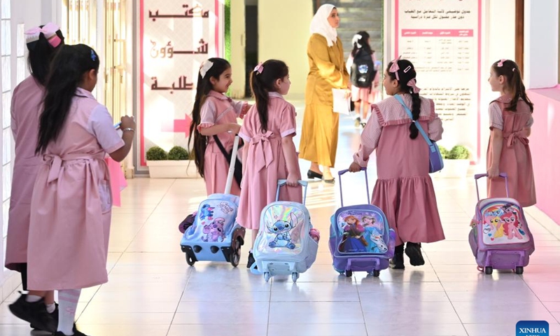 Students arrive at a school on the first day of a new academic year in Hawalli Governorate, Kuwait, on Sept. 17, 2024. (Photo: Xinhua)