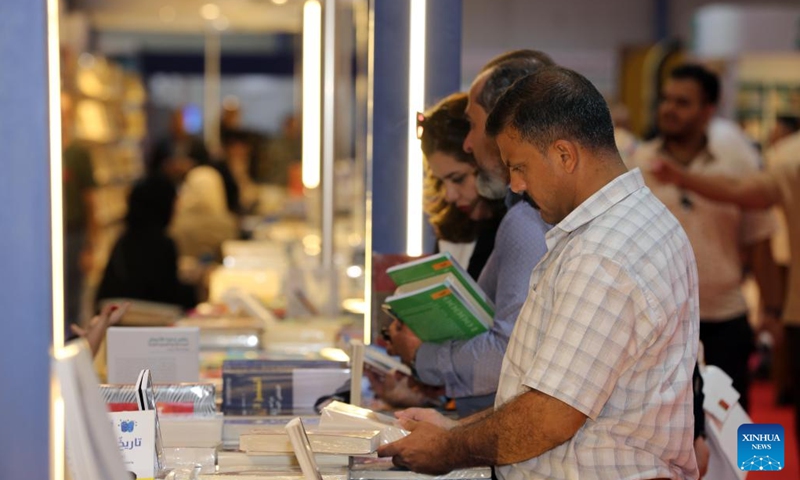 People select books at the 25th Baghdad International Book Fair in Baghdad, Iraq, on Sept. 17, 2024. (Photo: Xinhua)