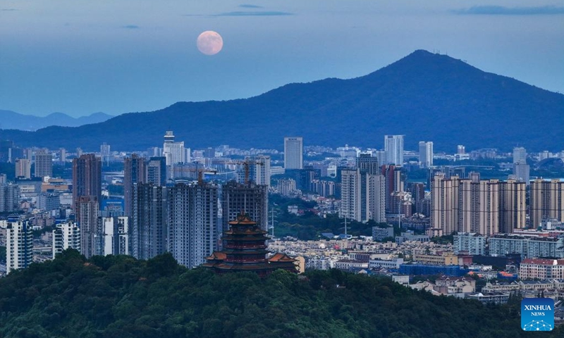 The moon rises above Nanjing, east China's Jiangsu Province, Sept. 17, 2024. The Mid-Autumn Festival in China, which is celebrated annually on the 15th day of the eighth month in the Chinese lunar calendar, falls on Sept. 17 this year. As one of China's most important traditional holidays, it is a joyous time when families come together, appreciate the full moon and share moon cakes, a traditional pastry, to mark the harvest season.  (Photo: Xinhua)