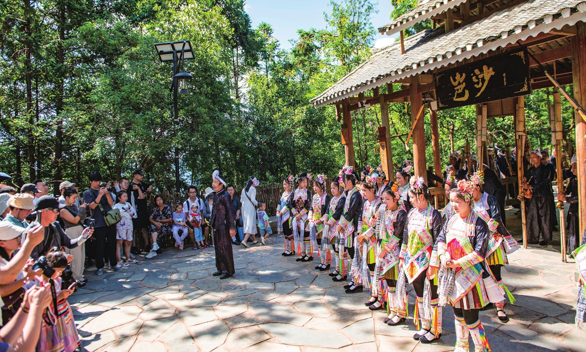 Villagers perform a welcome ceremony for tourists in Congjiang county, Southwest China's Guizhou Province, on July 23, 2024. Photo: VCG