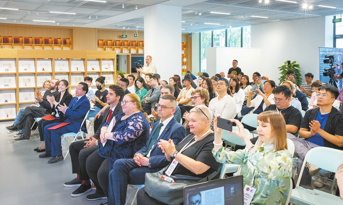 Attendees watch a video clip. Photo: Courtesy of the Russian Cultural Center in Beijing