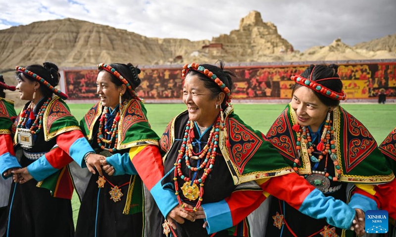 Local residents perform Xuan Dance near the ruins of the Guge Kingdom in Zanda County of Ngari Prefecture, southwest China's Xizang Autonomous Region, Sept. 11, 2024. The dance is a Tibetan cultural heritage from the ancient Guge Kingdom that mixes speech, singing and dancing. It was inscribed into the national intangible cultural heritage list in 2008. (Photo: Xinhua)