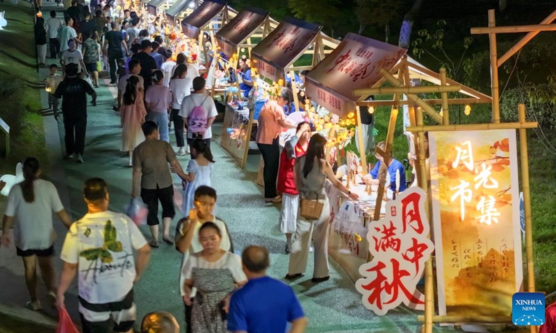 In this drone photo, tourists visit a night market at Taixing City, east China's Jiangsu Province, Sept. 15, 2024.  (Photo: Xinhua)