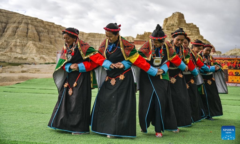 Local residents perform Xuan Dance near the ruins of the Guge Kingdom in Zanda County of Ngari Prefecture, southwest China's Xizang Autonomous Region, Sept. 11, 2024. The dance is a Tibetan cultural heritage from the ancient Guge Kingdom that mixes speech, singing and dancing. It was inscribed into the national intangible cultural heritage list in 2008. (Photo: Xinhua)