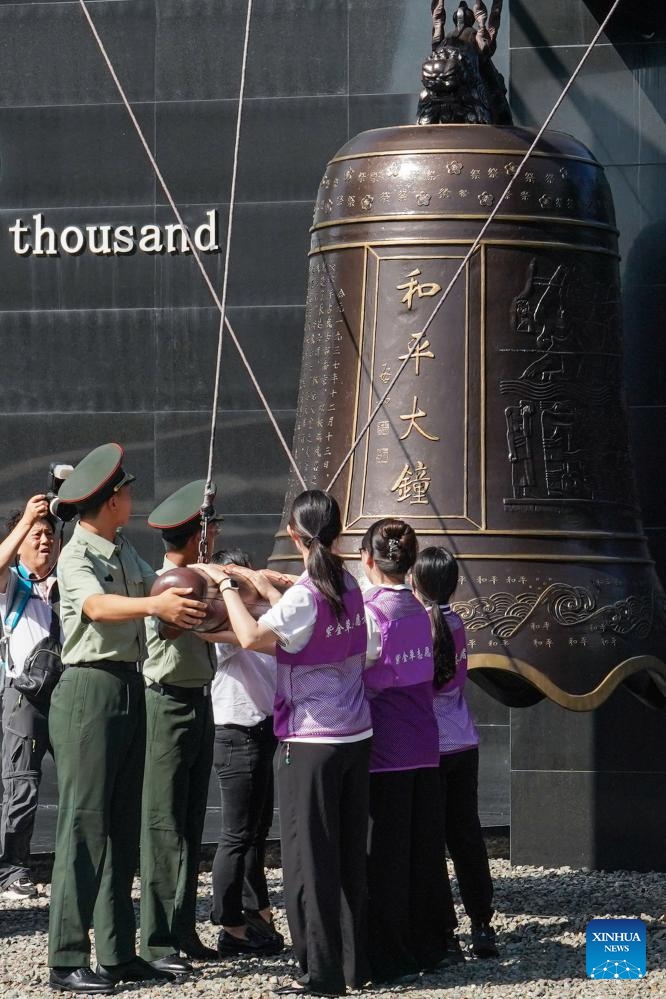 People strike the Bell of Peace at the Memorial Hall of the Victims in Nanjing Massacre by Japanese Invaders in Nanjing, east China's Jiangsu Province, Sept. 18, 2024. People from Nanjing and other places commemorated the 93rd anniversary of September 18 Incident, which marked the outbreak of Japan's large-scale invasion of China. (Photo: Xinhua)