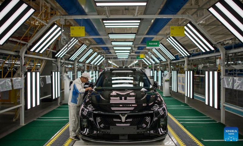 A worker checks the quality of a new vehicle at an assembly line of Dongfeng Motor Corporation in Wuhan, central China's Hubei Province, Sept. 6, 2024.  (Photo: Xinhua)