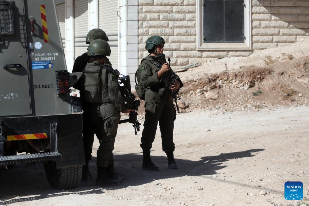 Israeli soldiers stand guard in the village of Beit Awa near the West Bank city of Hebron, on Sept. 19, 2024. (Photo: Xinhua)