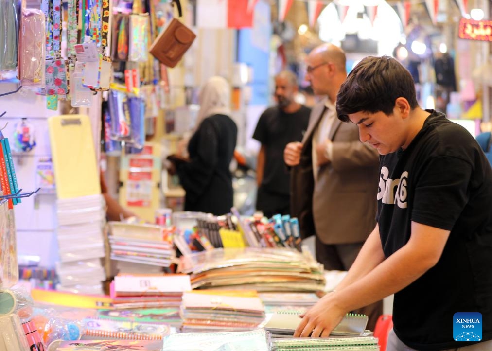 Customers buy school supplies in preparation for the new school year in Baghdad, Iraq, Sept. 19, 2024. (Photo: Xinhua)