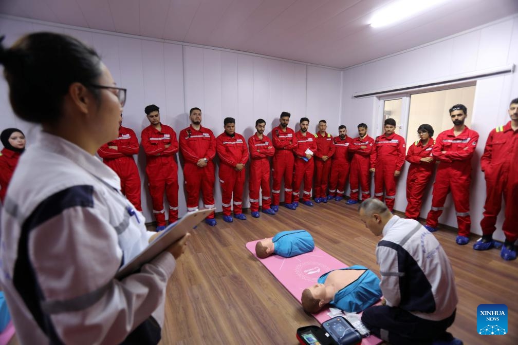 Medical personnel conduct first aid training at the Regional Health Service Center of Maysan Oilfield, Maysan, Iraq, Sept. 12, 2024. Invested and built by China Oilfield Services Limited Iraq Branch, the Regional Health Service Center of Maysan Oilfield in Iraq was officially put into operation in 2023. In order to ensure the safety of Iraqi and Chinese workers, the center has carried out emergency rescue training for about 800 people so far. (Photo: Xinhua)