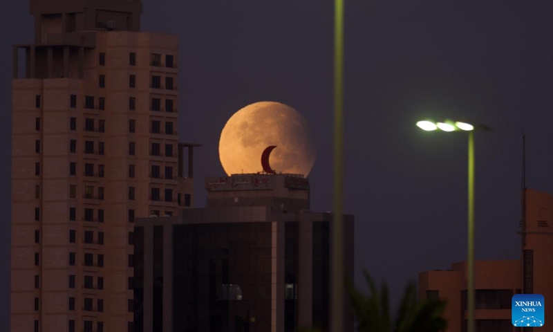 The moon is seen in the sky over Kuwait City, Kuwait, on Sept. 18, 2024. (Photo: Xinhua)