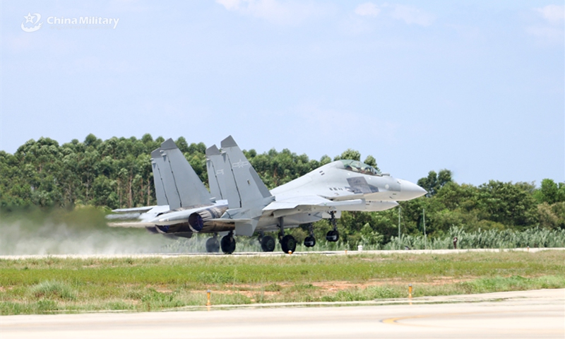 A fighter jet attached to an aviation brigade with the Chinese PLA Air Force takes off for a multi-subject flight training exercise.  (Photo: China Military Online )