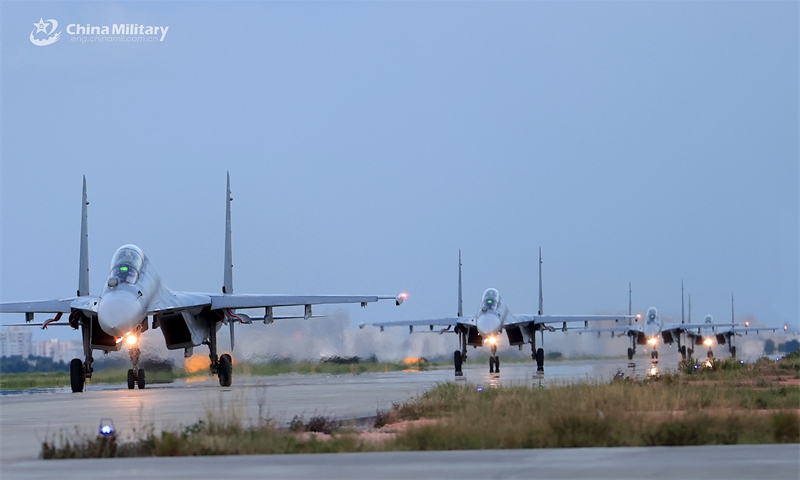 Fighter jets attached to an aviation brigade with the Chinese PLA Air Force taxi on the runway during a recent multi-subject flight training exercise. (Photo: China Military Online )