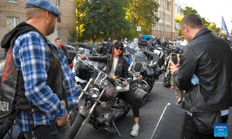 People look at a motorcycle before a motorcycle parade in Moscow, Russia, on Sept. 21, 2024. The parade marked the end of this year's motorcycle season in Moscow. (Photo: Xinhua)