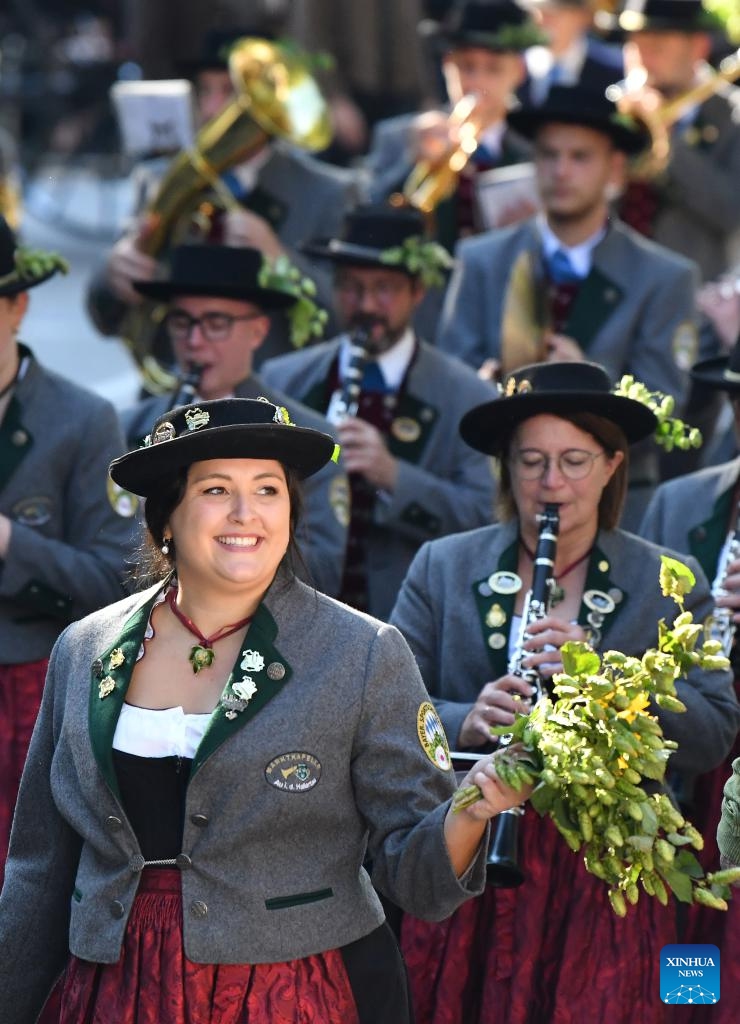 People take part in a parade during the official opening of the Oktoberfest in Munich, Germany, Sept. 21, 2024.

The 189th Oktoberfest, one of the largest folk festivals in Germany, opened on Saturday in Munich, with mayor Dieter Reiter tapping the first barrel of beer as a tradition. This year's festival will last until Oct. 6. (Photo: Xinhua)