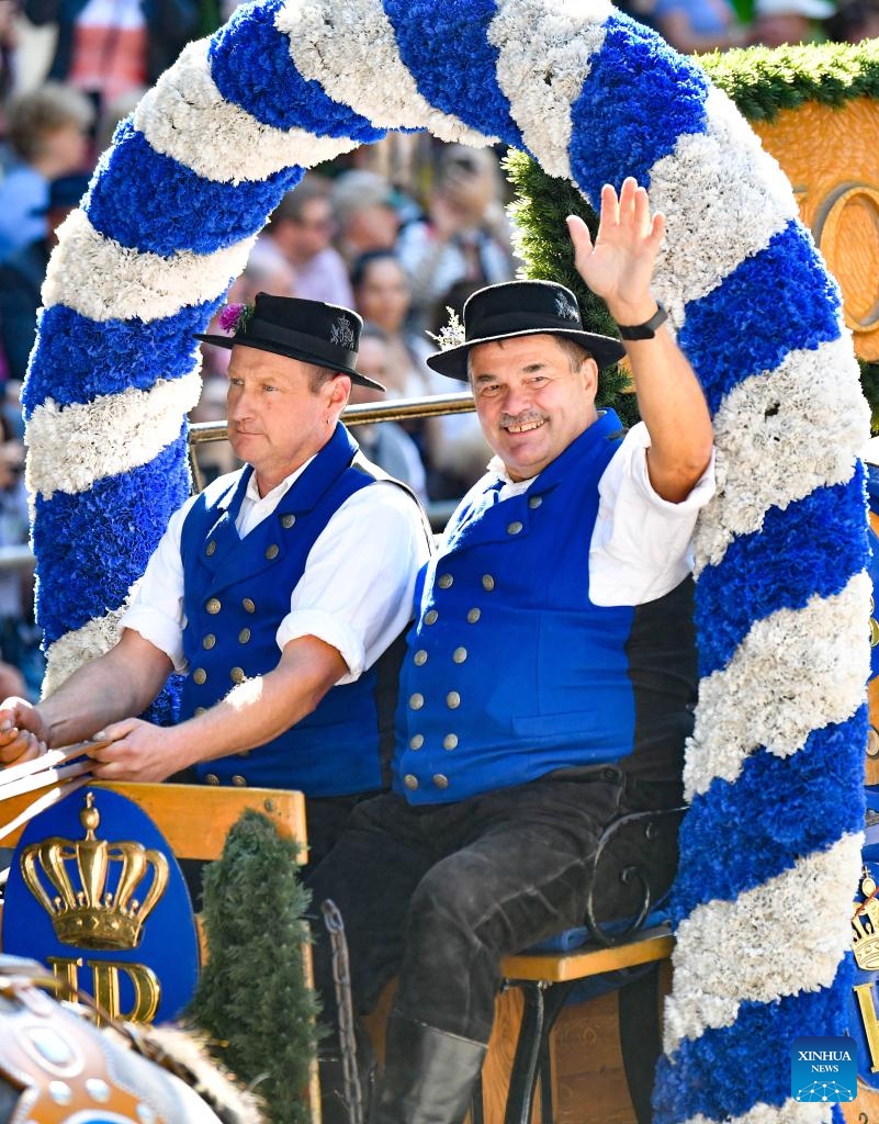 People take part in a parade during the official opening of the Oktoberfest in Munich, Germany, Sept. 21, 2024.

The 189th Oktoberfest, one of the largest folk festivals in Germany, opened on Saturday in Munich, with mayor Dieter Reiter tapping the first barrel of beer as a tradition. This year's festival will last until Oct. 6. (Photo: Xinhua)