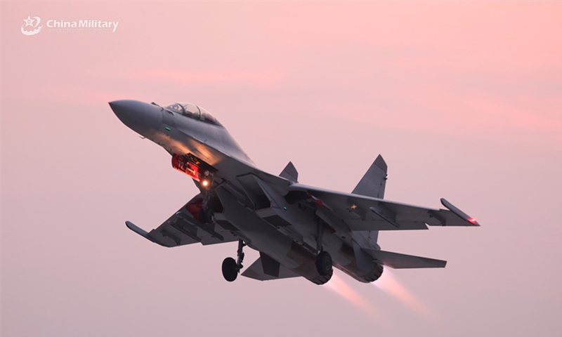 A fighter jet attached to an aviation brigade with the Chinese PLA Air Force soars into the sky during a recent multi-subject flight training exercise.   (Photo: China Military Online )