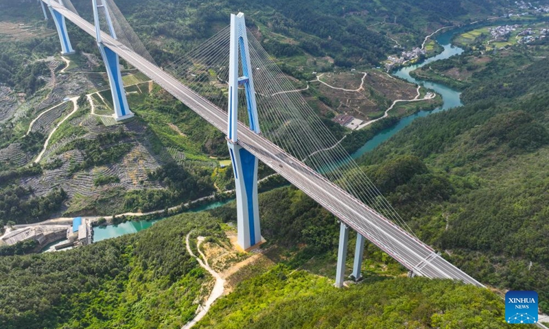 An aerial drone photo shows the Pingtang bridge on the expressway linking Pingtang and Luodian in southwest China's Guizhou Province, Sept. 5, 2024. Guizhou, with 92.5 percent of its area filled with mountains and hills, has been committed to eliminating bottlenecks in land transportation. Currently, the province has built over 200,000 km of highways, including more than 8,000 kilometers of expressways in operation. (Photo: Xinhua)