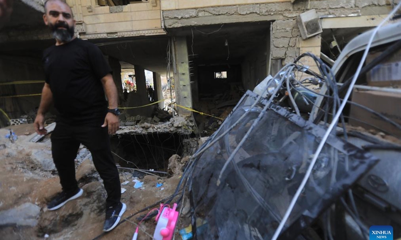 A man stands on the rubble at the site of an Israeli attack in Beirut, Lebanon, on Sept. 21, 2024. At least 31 people, including three children and seven women, were killed in the Israeli attack on Beirut on Friday, Lebanese Minister of Public Health Firass Abiad said on Saturday. (Photo: Xinhua)