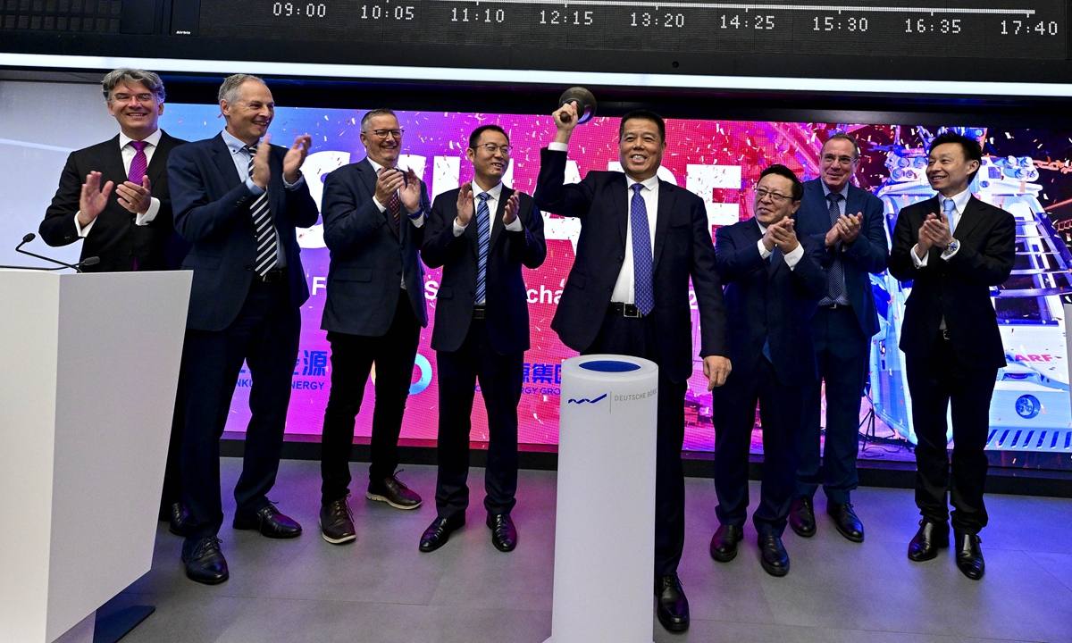 Li Wei (fourth from right), chairman of Shandong Energy Group, rings the bell to inaugurate Scharf AG's trading on the Frankfurt Stock Exchange on September 24, 2024. Chinese Shandong Energy Group's subsidiary Yankuang Energy on September 19 completed the acquisition of a 52.66 percent stake in German Scharf AG for a payment of 32.17 million euros ($35.89 million). Photo: Courtesy of Yankuang Energy 