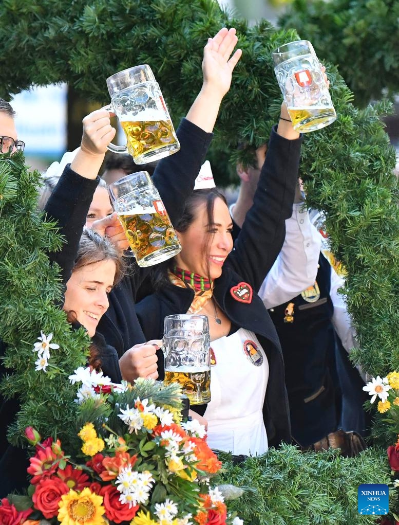 People take part in a parade during the official opening of the Oktoberfest in Munich, Germany, Sept. 21, 2024.

The 189th Oktoberfest, one of the largest folk festivals in Germany, opened on Saturday in Munich, with mayor Dieter Reiter tapping the first barrel of beer as a tradition. This year's festival will last until Oct. 6. (Photo: Xinhua)