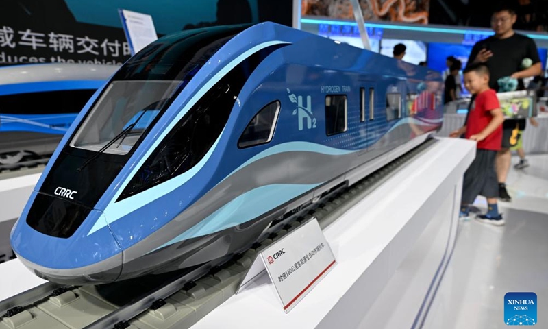 Visitors look at a model of a fully automatic hydrogen-powered train at the 2024 World Manufacturing Convention in Hefei, east China's Anhui Province, Sept. 21, 2024. The 2024 World Manufacturing Convention opened Friday in Hefei, capital of east China's Anhui Province, highlighting the latest products and innovations in the manufacturing sector. (Photo: Xinhua)