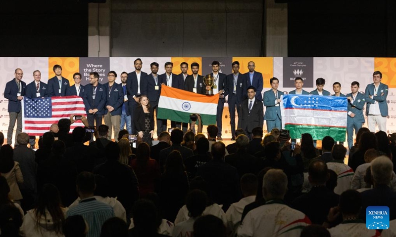 Members of gold medalist team India (C), silver medalist team USA (L), and bronze medalist Uzbekistan celebrate at the awards ceremony of the Men's category of the 45th FIDE Chess Olympiad Budapest 2024 in Budapest, Hungary on Sept. 22, 2024. (Photo: Xinhua)