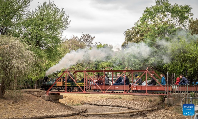 People ride on a miniature train at the Model Engineering Fair held in Centurion of Gauteng, South Africa, Sept. 22, 2024. The fair displays a variety of steam locomotives and other model trains. (Photo: Xinhua)