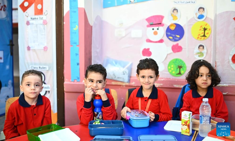 Students have breakfast on the first day of a new academic year in Cairo, Egypt, Sept. 22, 2024. (Photo: Xinhua)