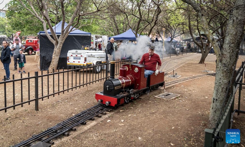 A model train enthusiast operates a miniature train at the Model Engineering Fair held in Centurion of Gauteng, South Africa, Sept. 22, 2024. The fair displays a variety of steam locomotives and other model trains. (Photo: Xinhua)