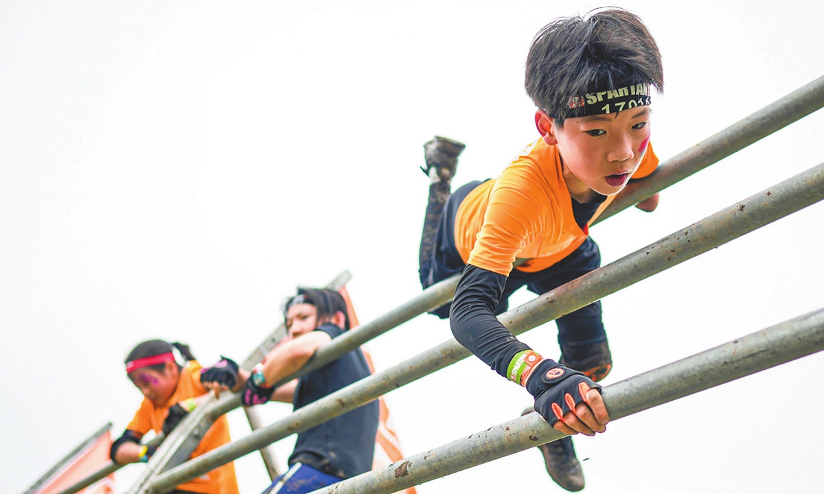 Ben Yuechen (right) competes in a Spartan kids race in Shanghai in April. Photo: Courtesy of SECA