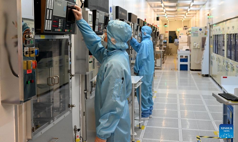 Staff of Anhui North Microelectronics Research Institute Group Corporation Limited work on the production line of MEMS wafers in the China Sensor Valley at Bengbu City, east China's Anhui Province, Sept. 12, 2024. China Speech Valley in Hefei City, the Vision Valley of China in Wuhu City and China Sensor Valley in Bengbu City, are three key demonstration zones for the artificial intelligence (AI) industry in Anhui Province. (Photo: Xinhua)