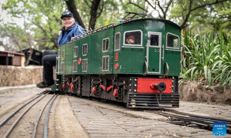 A model train enthusiast operates a miniature train at the Model Engineering Fair held in Centurion of Gauteng, South Africa, Sept. 22, 2024. The fair displays a variety of steam locomotives and other model trains. (Photo: Xinhua)