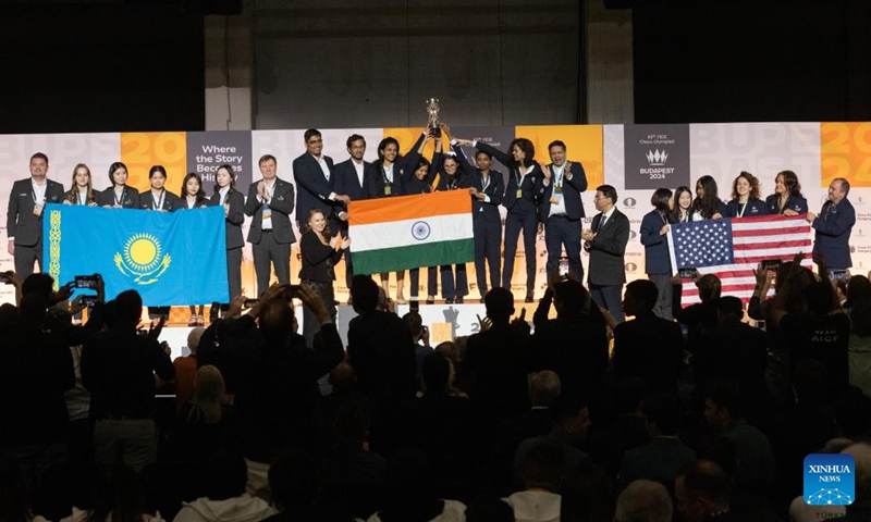 Members of gold medalist team India (C), silver medalist team Kazakhstan (L), and bronze medalist team USA celebrate at the awards ceremony of the Women's category of the 45th FIDE Chess Olympiad Budapest 2024 in Budapest, Hungary on Sept. 22, 2024. (Photo: Xinhua)