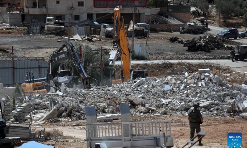 Israeli bulldozers demolish a Palestinian residential house in the village of Idna, west of the West Bank city of Hebron, on Sept. 23, 2024. (Photo: Xinhua)