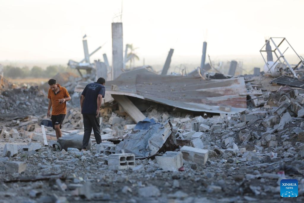 Palestinians check a destroyed house after an Israeli attack in Al-Bureij refugee camp in the central Gaza Strip, on Sept. 23, 2024. (Photo: Xinhua)