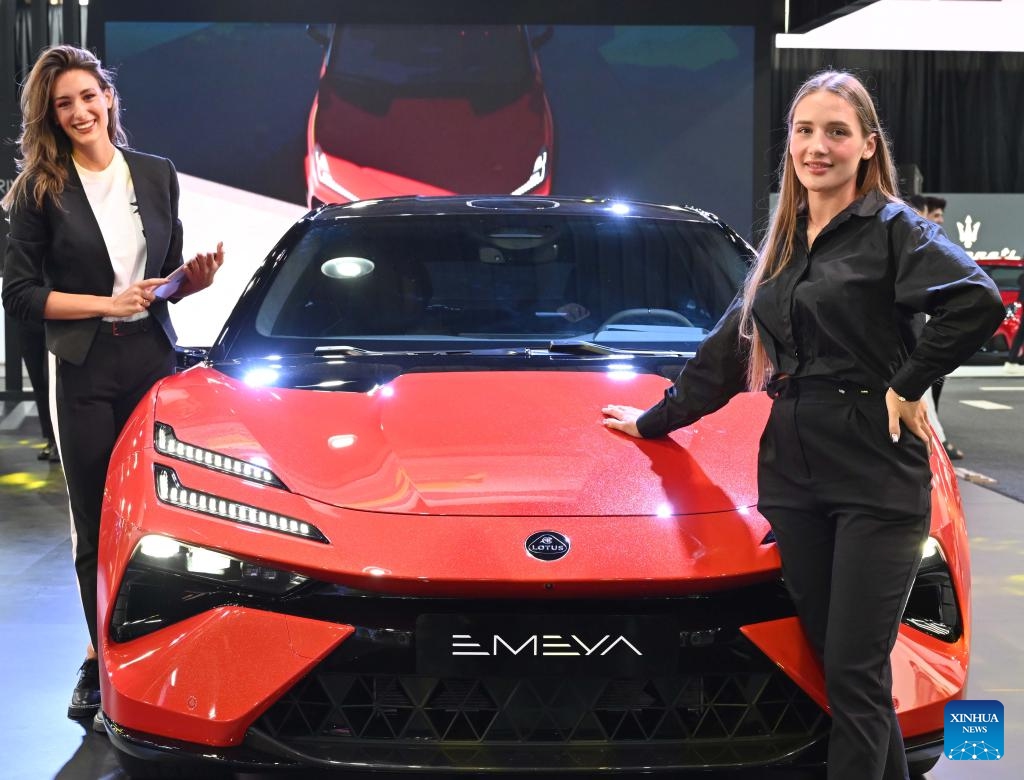 Models display a Lotus Emeya car at the Auto World Show in Hawalli Governorate, Kuwait, Sept. 23, 2024. The six-day event kicked off here Monday. (Photo: Xinhua)