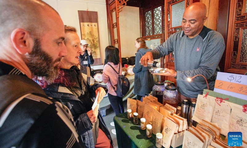 People taste Indian tea during the Garden Tea Festival at Dr. Sun Yat-Sen Classical Chinese Garden in Vancouver, British Columbia, Canada, Sept. 22, 2024. (Photo: Xinhua)