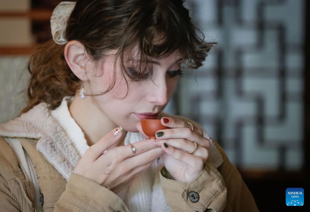 A woman tastes Chinese tea during the Garden Tea Festival at Dr. Sun Yat-Sen Classical Chinese Garden in Vancouver, British Columbia, Canada, Sept. 22, 2024. (Photo: Xinhua)