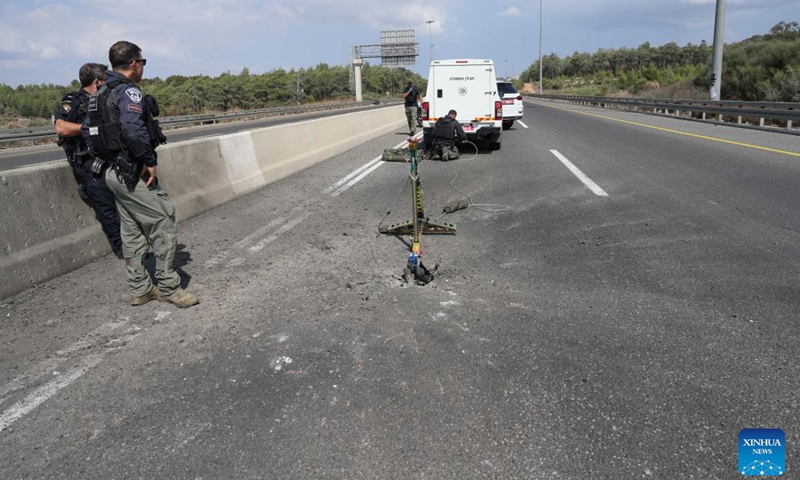 Members of Israeli security forces work at the scene of a rocket attack from Lebanon, in Giv'at Avni, northern Israel, on Sept. 23, 2024. Hezbollah fired over 180 rockets toward northern Israel throughout Monday, the Israeli military reported. Israel's aerial defense systems intercepted some projectiles, while others fell within Israeli territory, causing fires. (Photo: Xinhua)