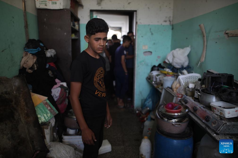 Palestinians inspect a destroyed building after the Israeli attack on a school-turned shelter in Nuseirat refugee camp in the central Gaza Strip, on Sept. 23, 2024. (Photo: Xinhua)