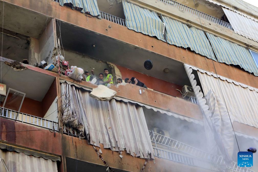 Rescuers work at a building targeted by an Israeli warplane in Beirut, Lebanon, on Sept. 24, 2024. The Israeli military confirmed on Tuesday that it killed a senior Hezbollah commander in an airstrike on the southern suburbs of Beirut. In a statement, the military identified the commander as Ibrahim Muhammad Qubaisi, who was reportedly in charge of Hezbollah's missile and rocket operations. (Photo: Xinhua)