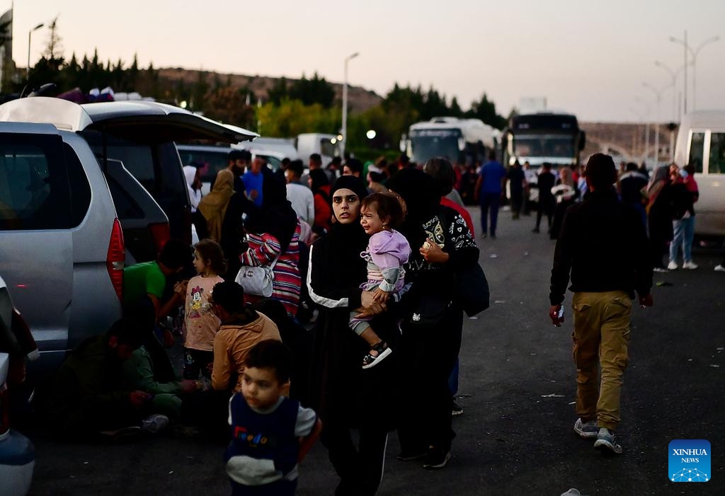 People fleeing from Lebanon are seen at the Jdeidat Yabous border crossing in the countryside of Damascus, Syria, on Sept. 24, 2024. Syrian authorities are facilitating entry at border crossings for both Lebanese and returning Syrian nationals, local media outlet Al-Watan Online reported on Tuesday. (Photo: Xinhua)