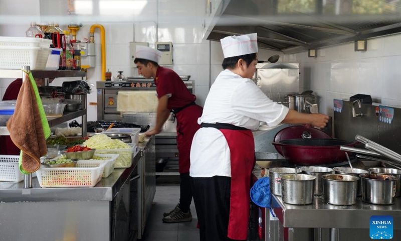 Workers prepare lunch at a canteen for the elderly at the Donghu residential community in Kashgar, northwest China's Xinjiang Uygur Autonomous Region, Sept. 22, 2024. In recent years, the Donghu residential community in Kashgar has been actively exploring new models of service management for groups such as the elderly and young children. (Photo: Xinhua)