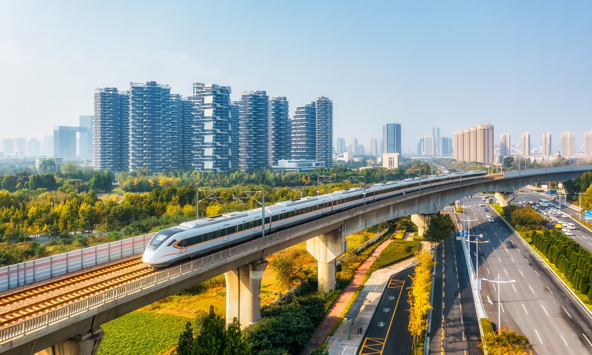 A high-speed train travels along the intercity railway between Zhengzhou and Kaifeng, cities in Central China's Henan Province. Photo: VCG