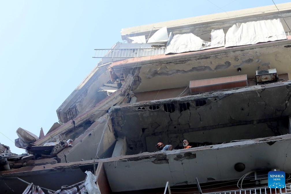 Rescuers work at a building targeted by an Israeli warplane in Beirut, Lebanon, on Sept. 24, 2024. The Israeli military confirmed on Tuesday that it killed a senior Hezbollah commander in an airstrike on the southern suburbs of Beirut. In a statement, the military identified the commander as Ibrahim Muhammad Qubaisi, who was reportedly in charge of Hezbollah's missile and rocket operations. (Photo: Xinhua)