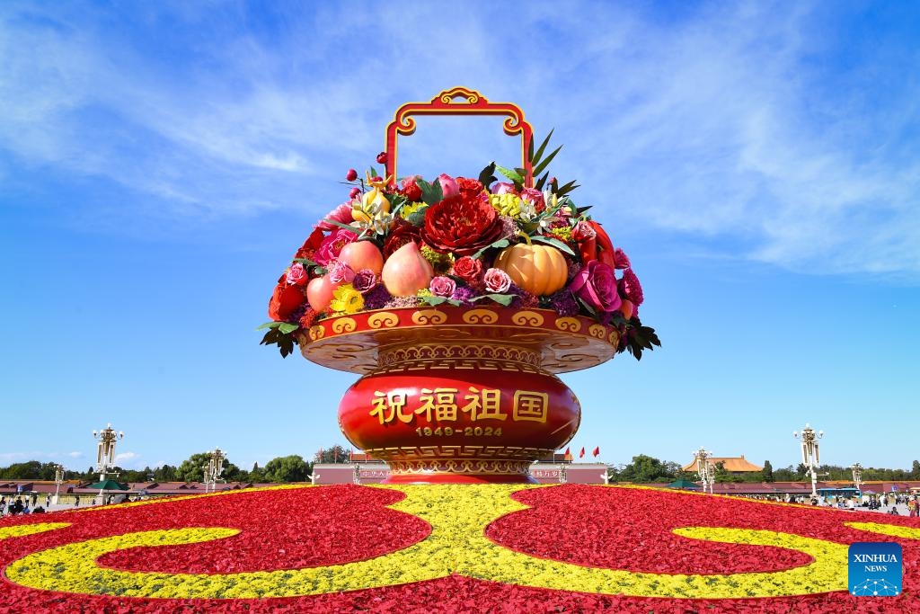 This photo taken on Sept. 25, 2024 shows a flower basket at Tian'anmen Square in Beijing, capital of China. The 18-meter-tall display in the shape of a flower basket is placed at Tian'anmen Square as a decoration for the upcoming National Day holiday. (Photo: Xinhua)