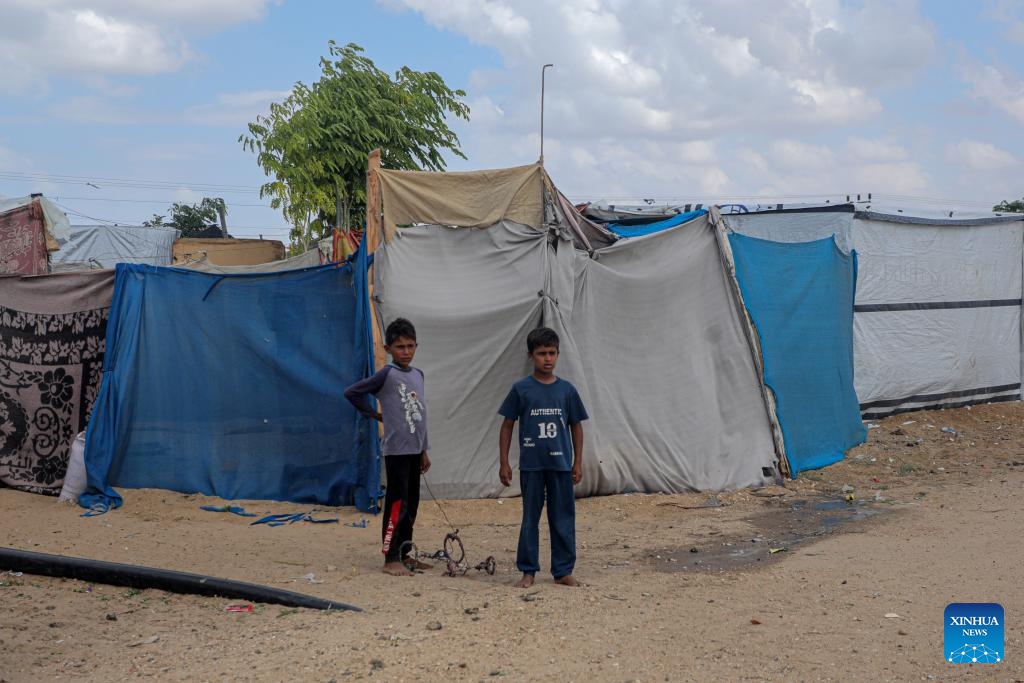 Children are seen in a temporary shelter in the southern Gaza Strip city of Khan Younis, on Sept. 23, 2024. If international organizations cannot provide us with tents, we face a harsh winter that could lead to the deaths of refugees due to the cold and lack of shelter, Om Fadi said. (Photo: Xinhua)