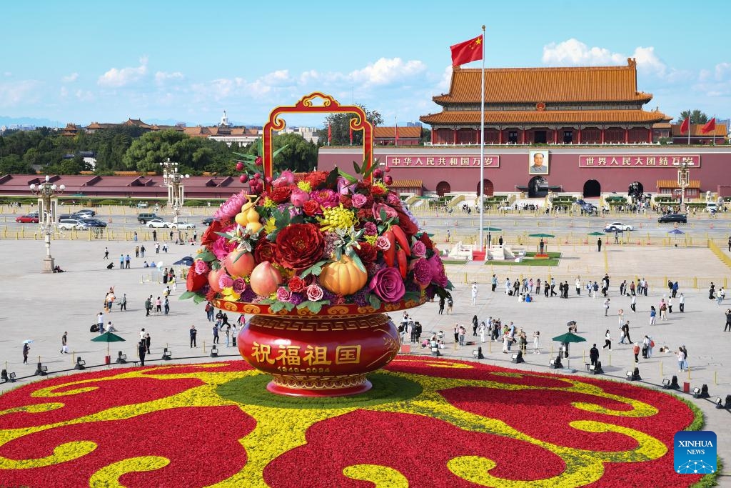 This photo taken on Sept. 25, 2024 shows a flower basket at Tian'anmen Square in Beijing, capital of China. The 18-meter-tall display in the shape of a flower basket is placed at Tian'anmen Square as a decoration for the upcoming National Day holiday. (Photo: Xinhua)